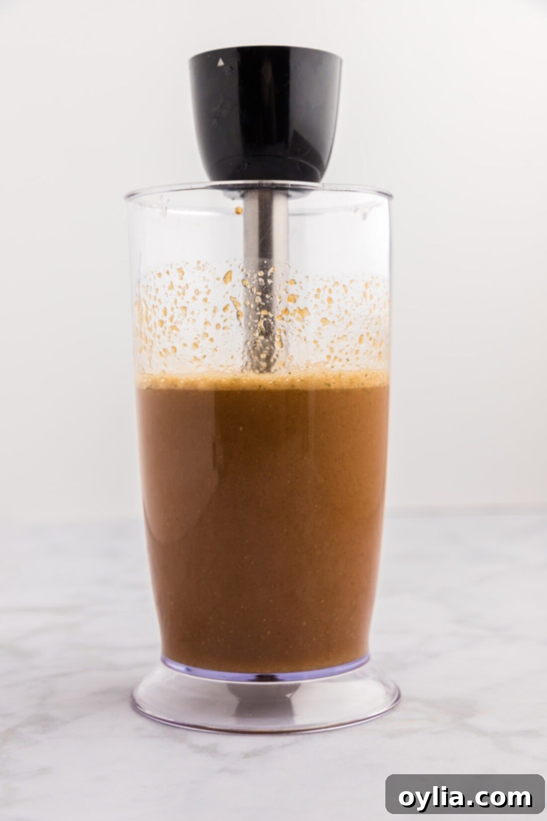 Honey Garlic Chicken Marinade in an immersion blender cup, ready to be blended for a smooth consistency.
