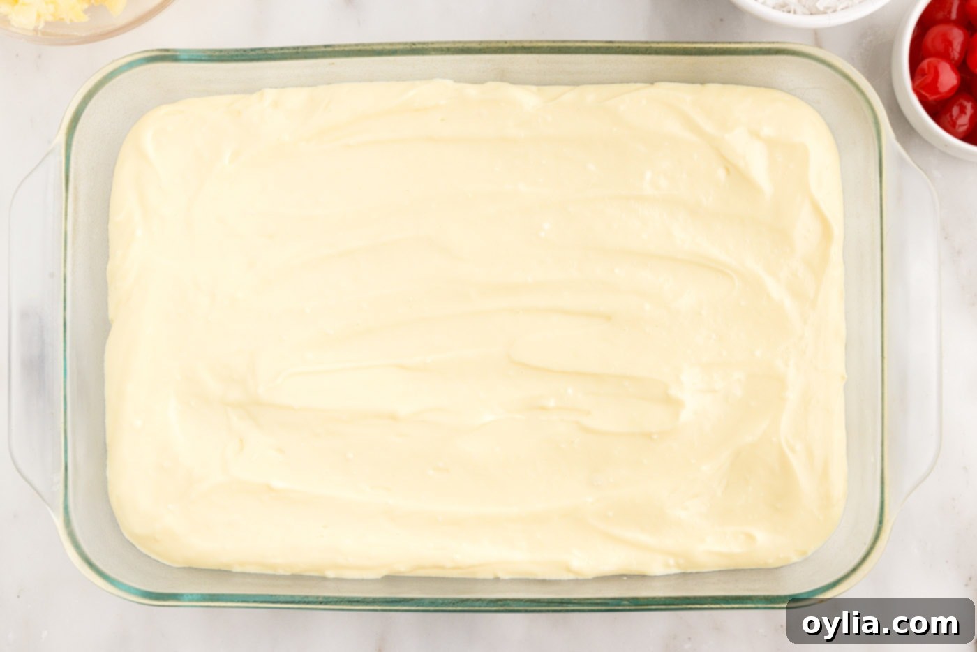 layer of cream cheese pudding over cake