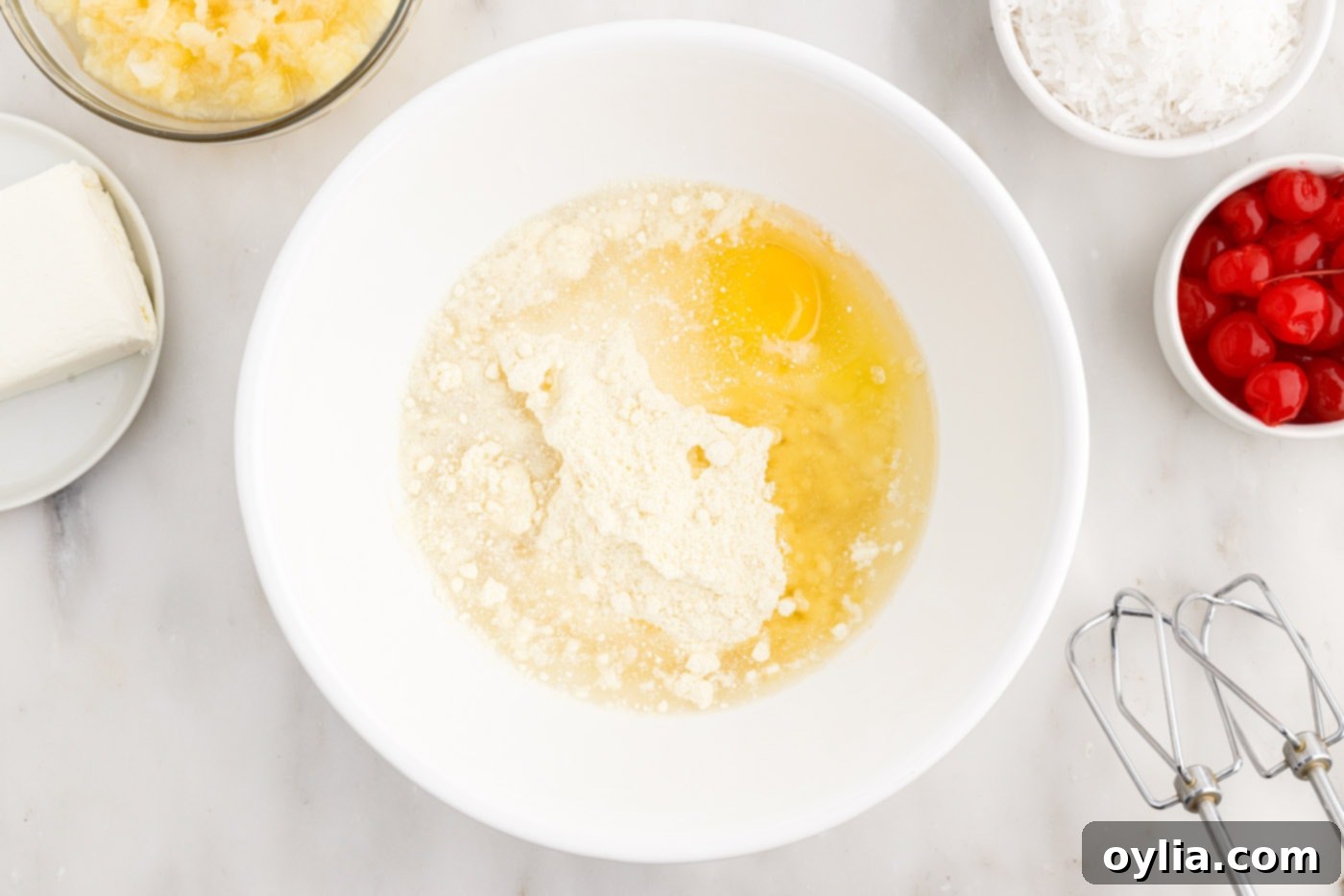 cake mix, eggs, water, and oil in a bowl