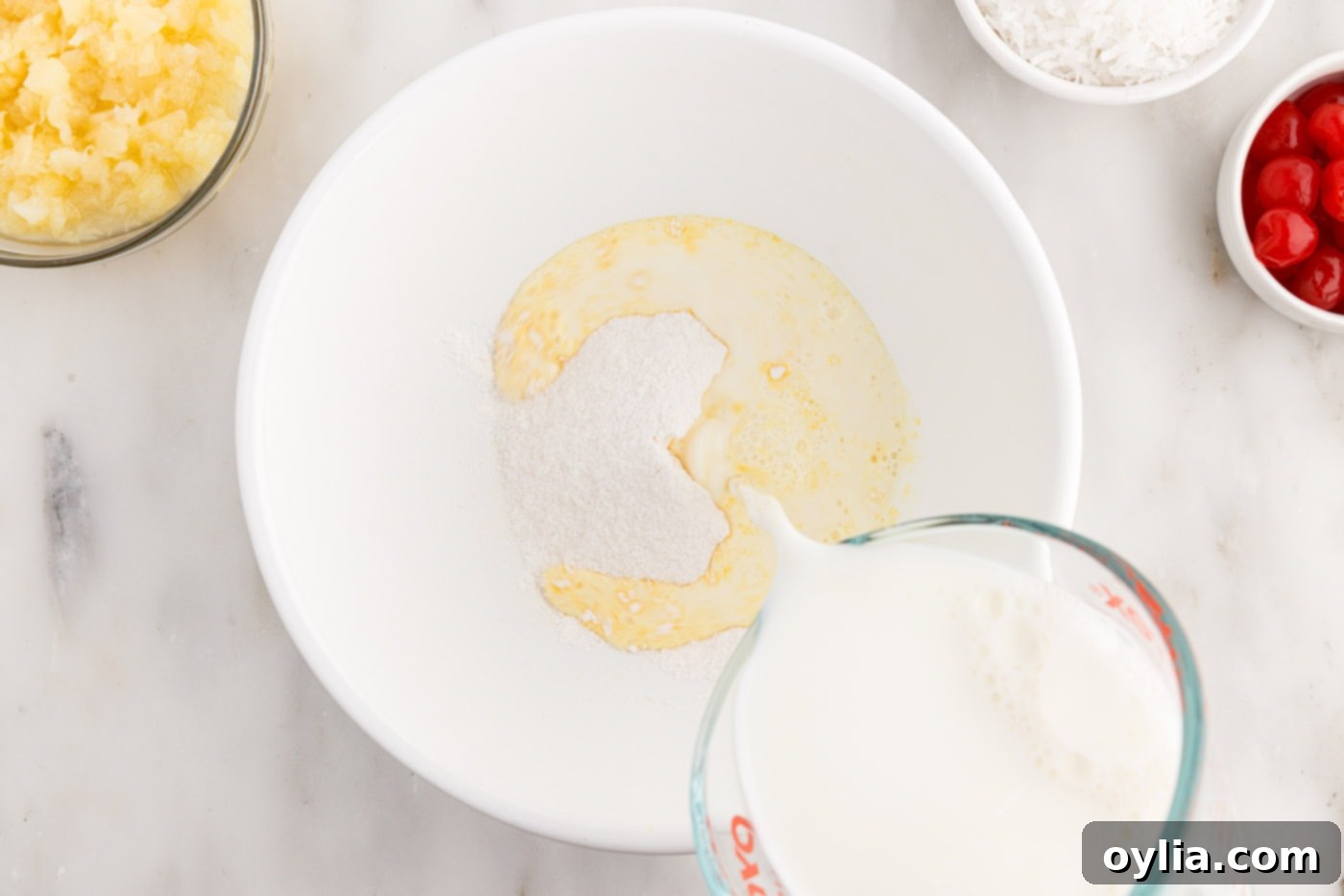 pouring milk into pudding mix