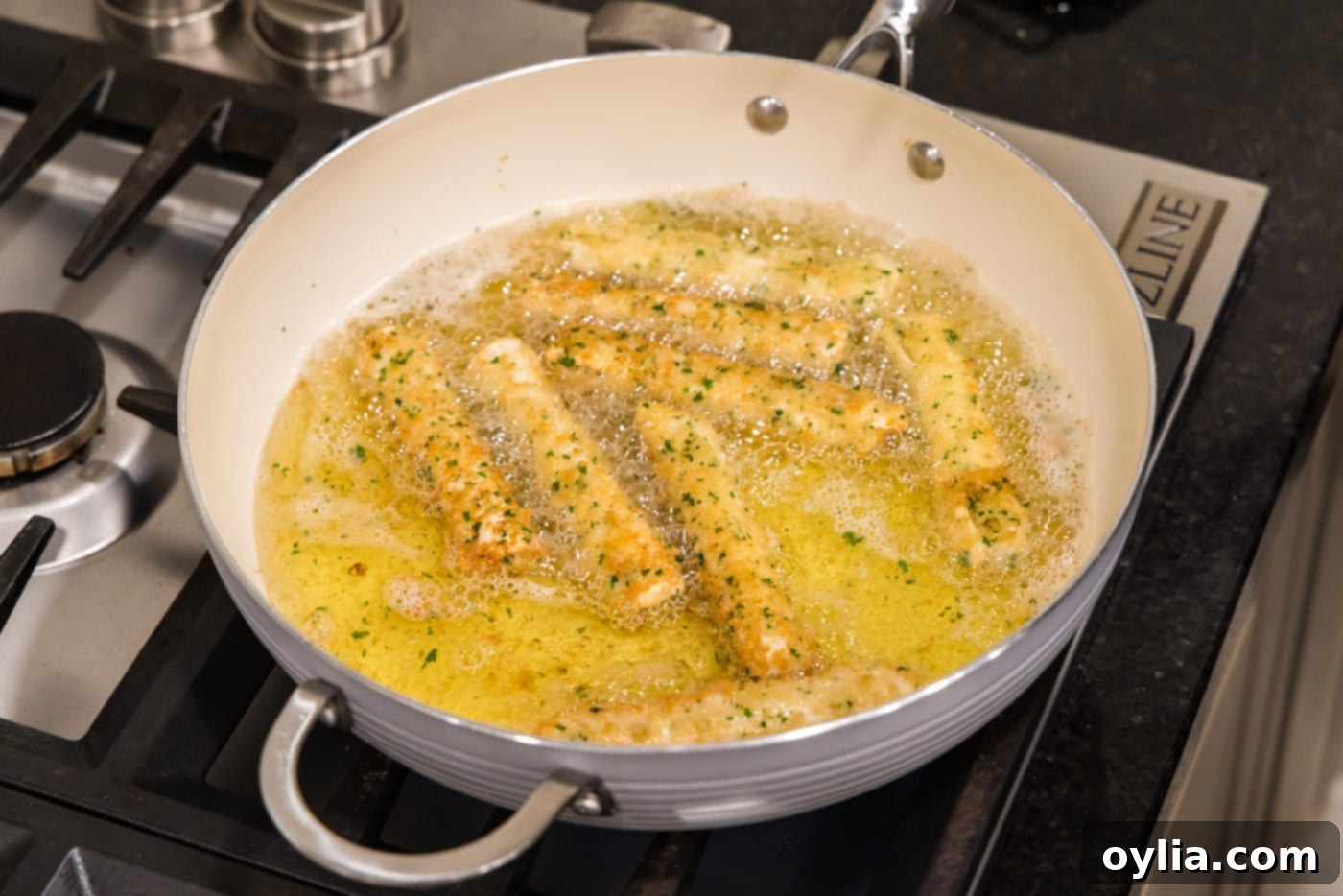 deep fried wonton cheese sticks in a skillet