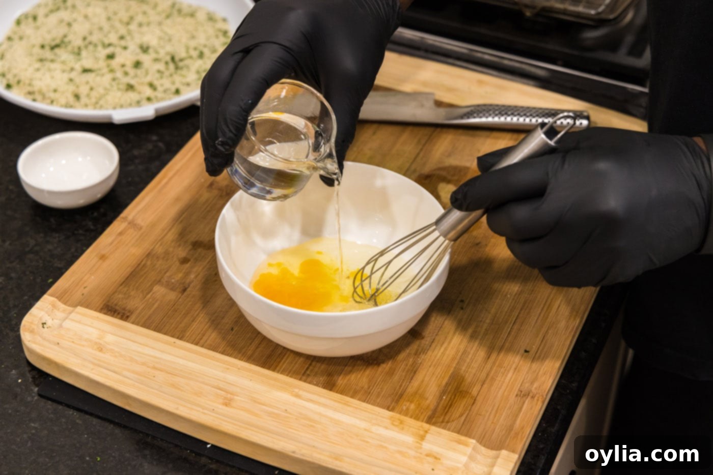 whisking egg with water