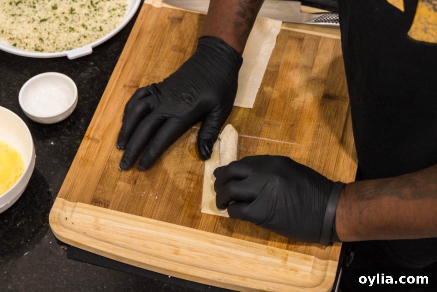 sealing string cheese inside and egg roll wrapper