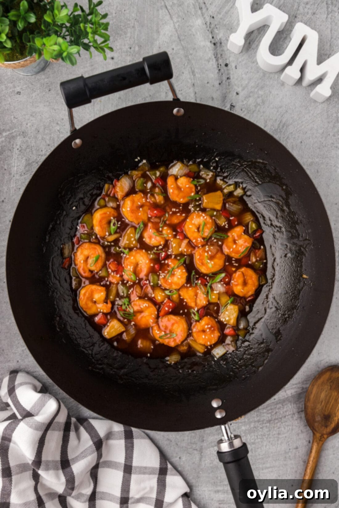 Large wok filled with vibrant Sweet and Sour Shrimp, showcasing the colorful dish.