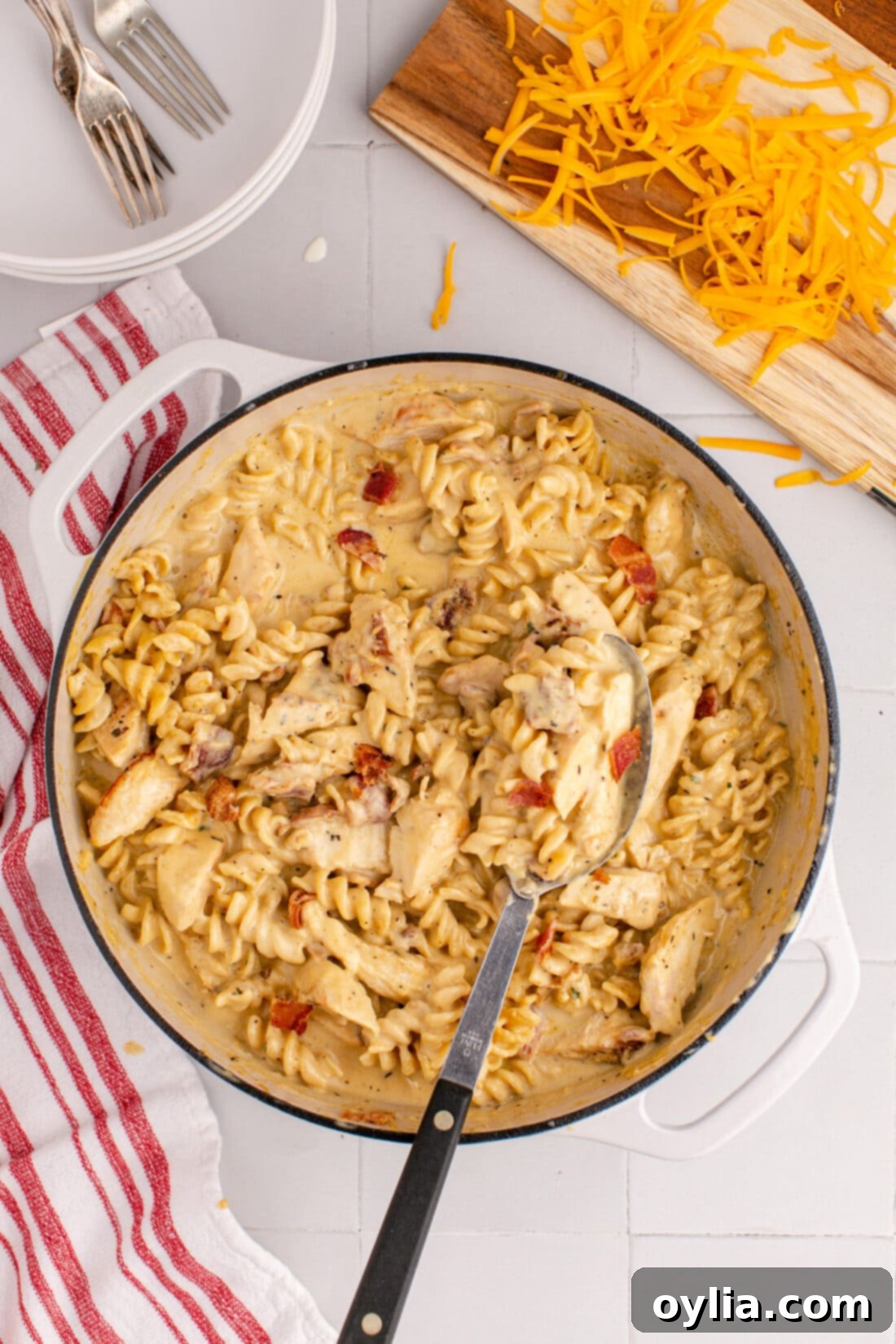 Pot of Bacon Chicken Ranch Pasta with a spoon in it, ready to be served