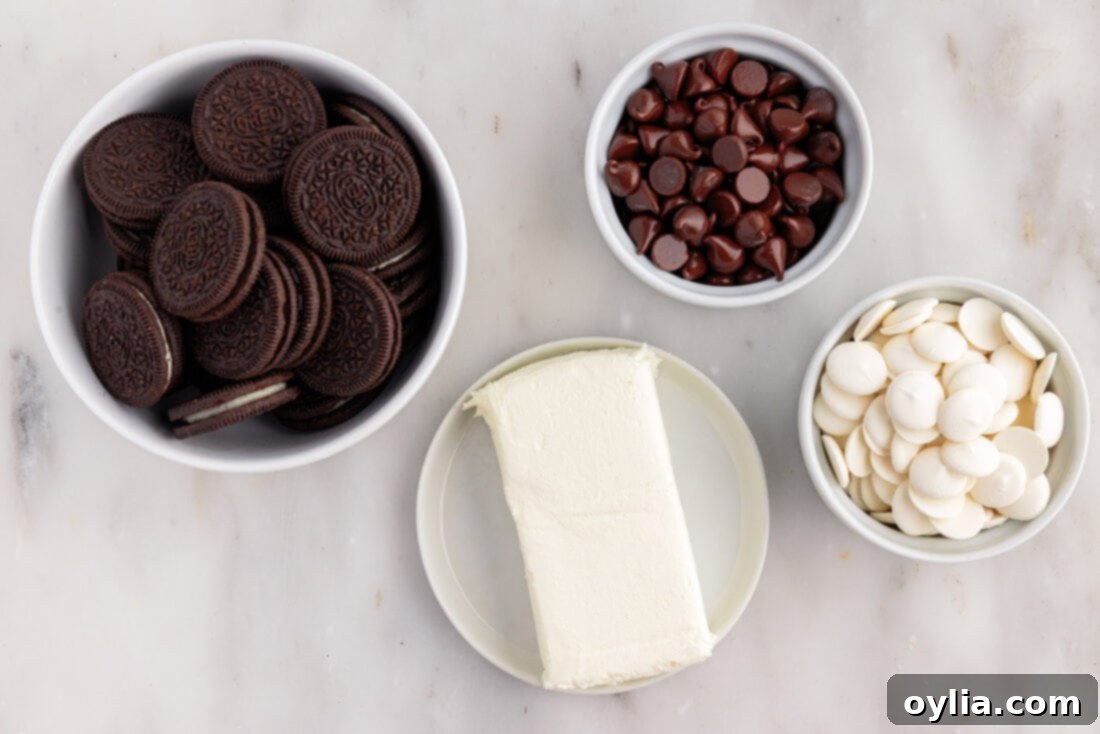 No-Bake Oreo Delights 4 Ingredients for Oreo Truffles laid out on a table, including Oreo cookies, cream cheese, and chocolate.