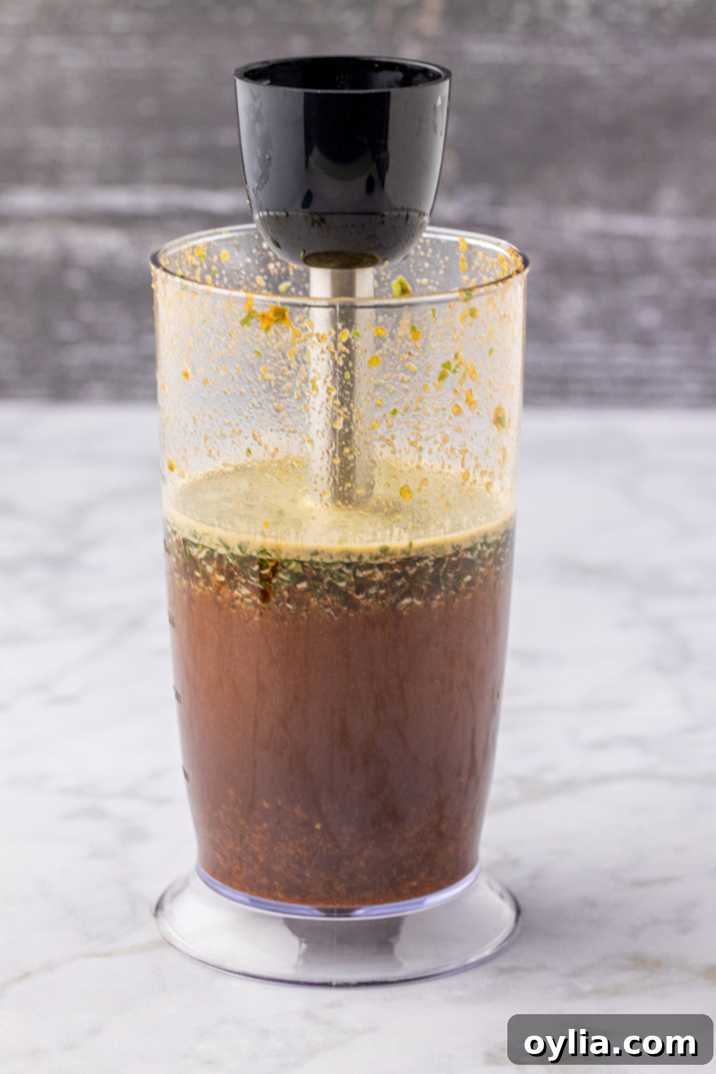 blitzing marinde ingredients with an immersion blender