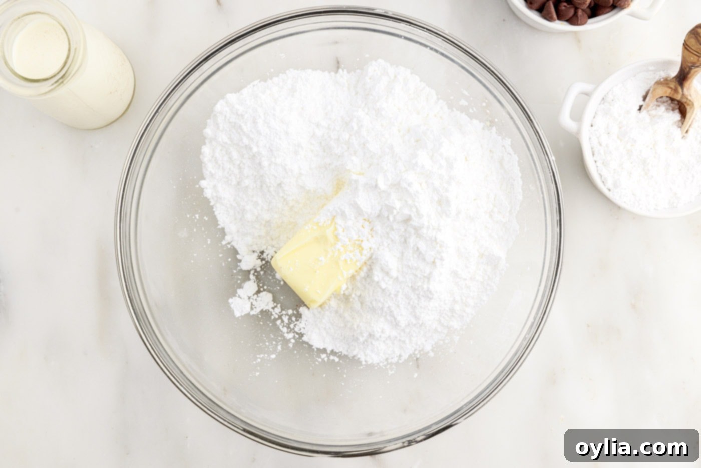 softened butter and powdered sugar in a mixing bowl