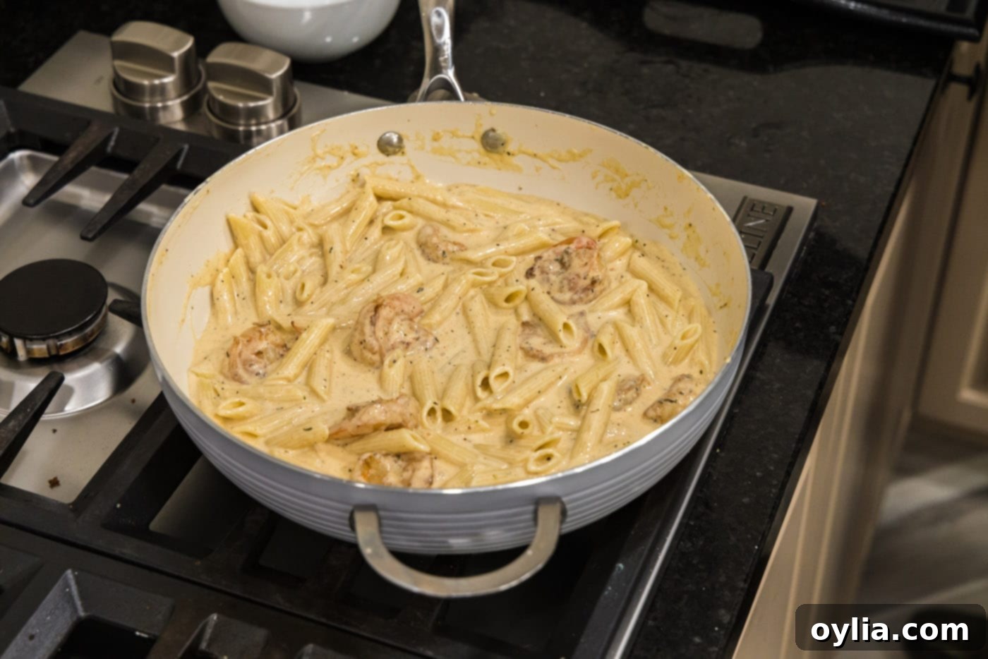 creamy cajun shrimp pasta on the stovetop