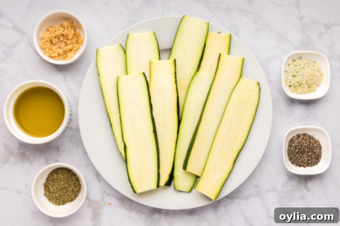 Fresh ingredients for grilled zucchini including whole zucchini, garlic, olive oil, and various spices.