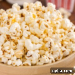 Close up photo of a bowl of Kettle Corn, showing individual glazed pieces.