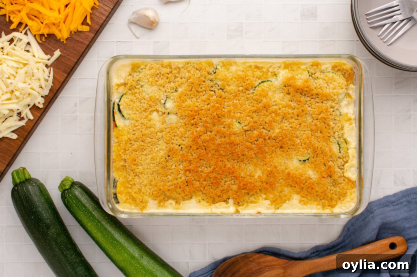 The finished Zucchini Casserole, bubbly and golden brown from broiling with a crispy panko topping, viewed from overhead.