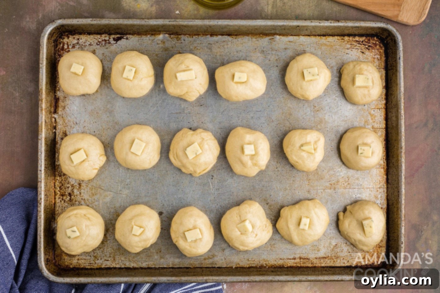 Golden Garlic Cheese Rolls 12 small cube of cheese placed on top of dough balls before baking