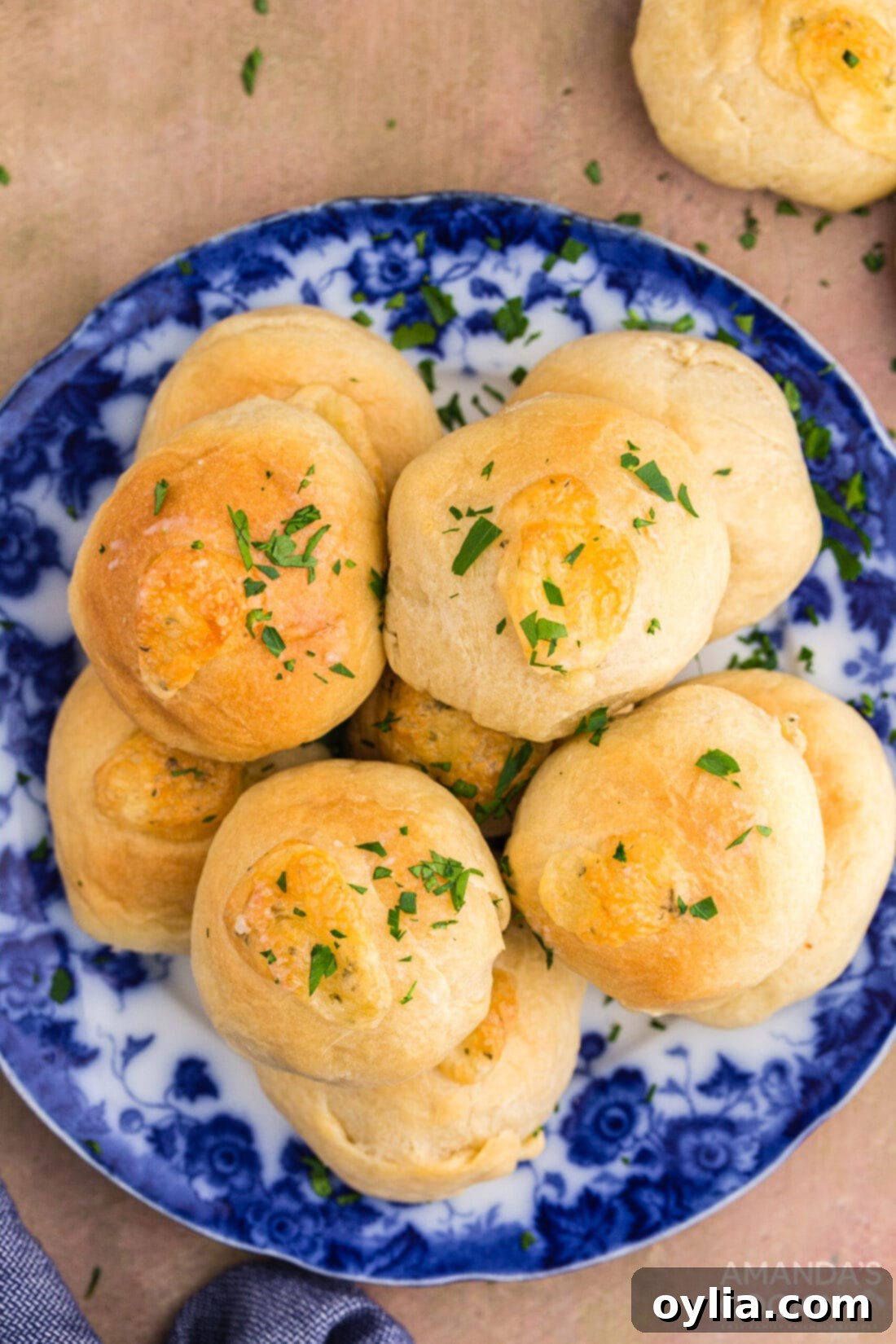 Golden Garlic Cheese Rolls 14 plate of garlic cheese rolls, one bitten into with cheese oozing