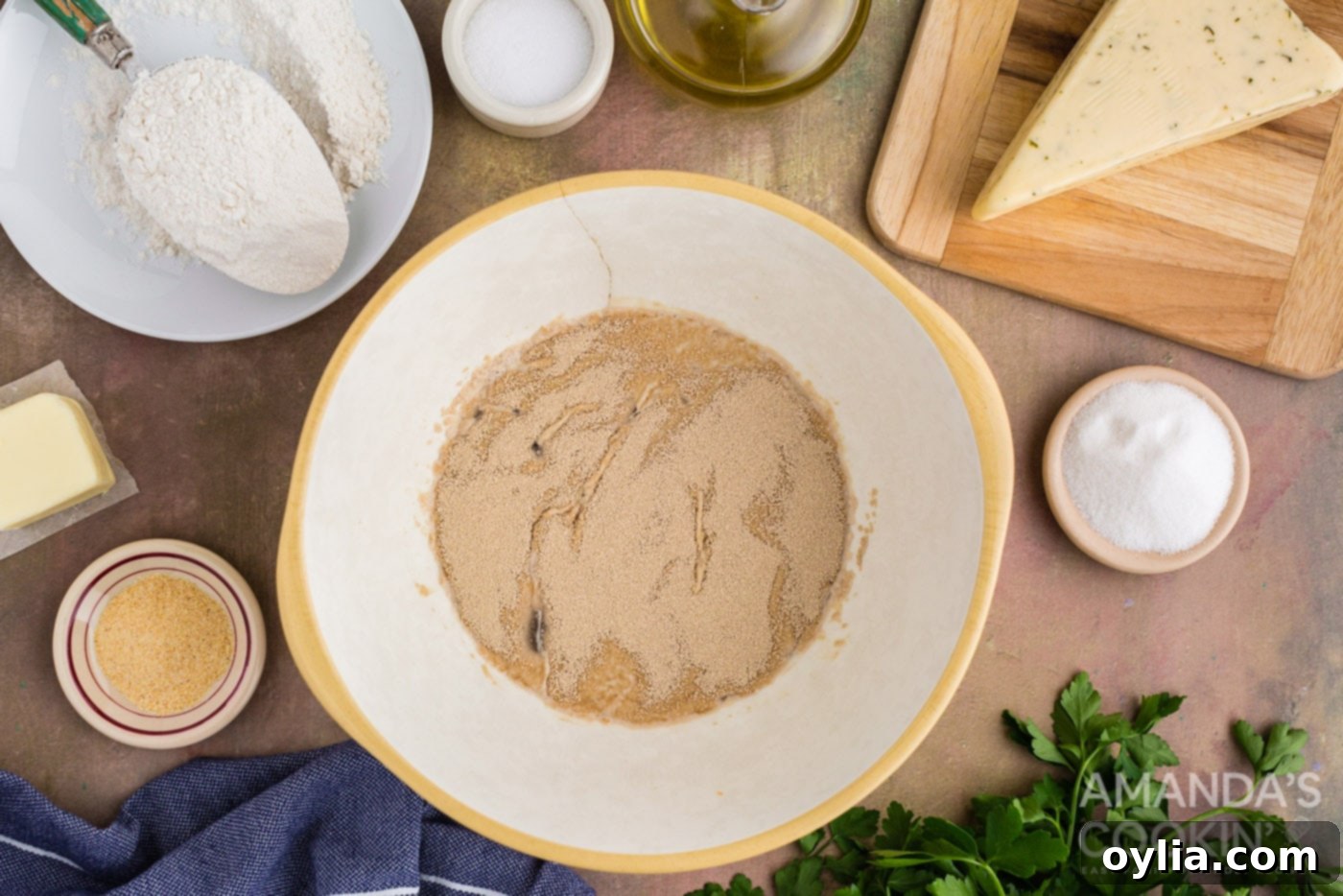 Golden Garlic Cheese Rolls 5 yeast over warm water in a bowl