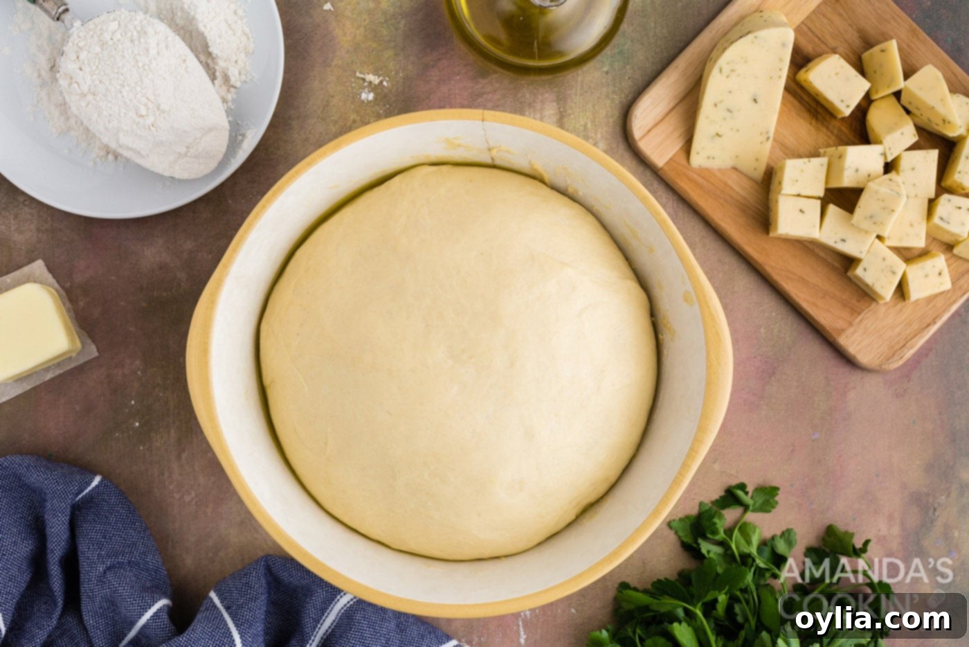 Golden Garlic Cheese Rolls 9 risen dough ball in a bowl after 30 minutes