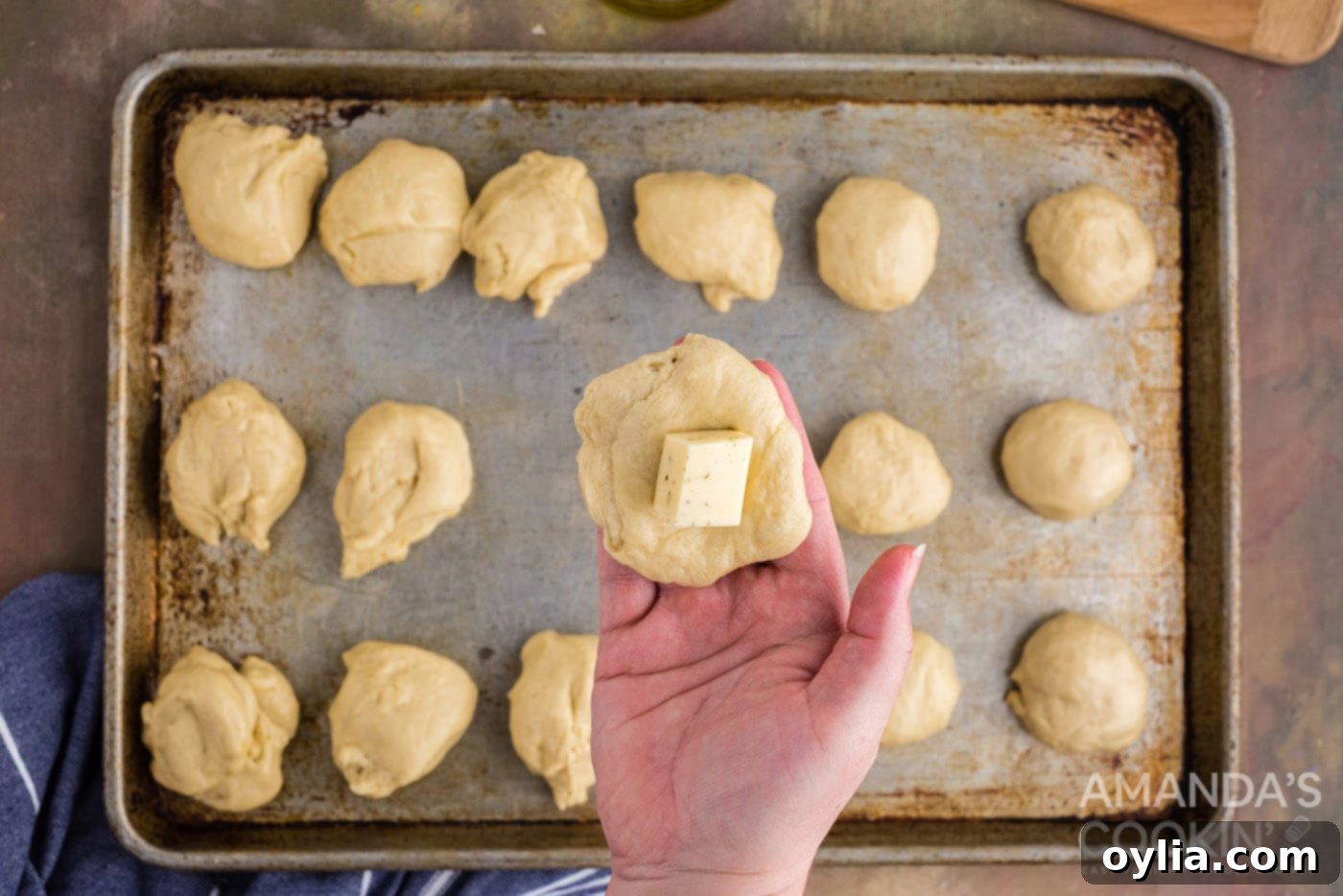 Golden Garlic Cheese Rolls 10 adding cheese to a small portion of dough
