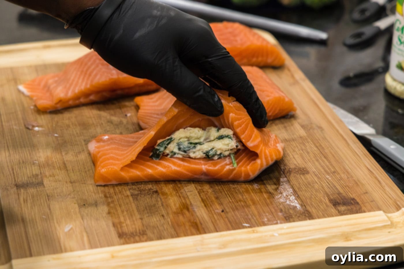 adding stuffing to salmon pocket