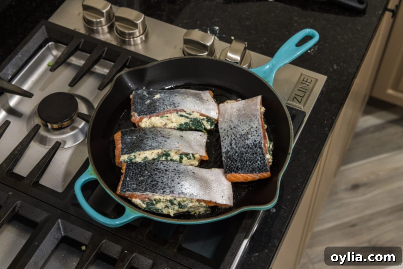searing salmon skin side up in a skillet