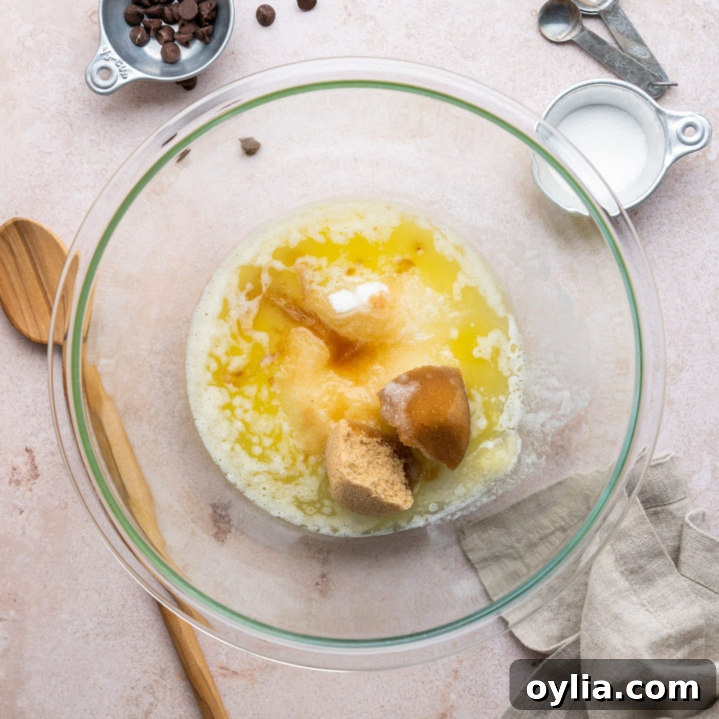 granulated sugar, brown sugar, oil, butter, and vanilla in a large bowl before mixing