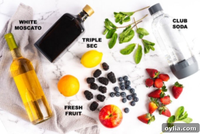 ingredients for white sangria including wine, liqueur, soda, and fresh fruit