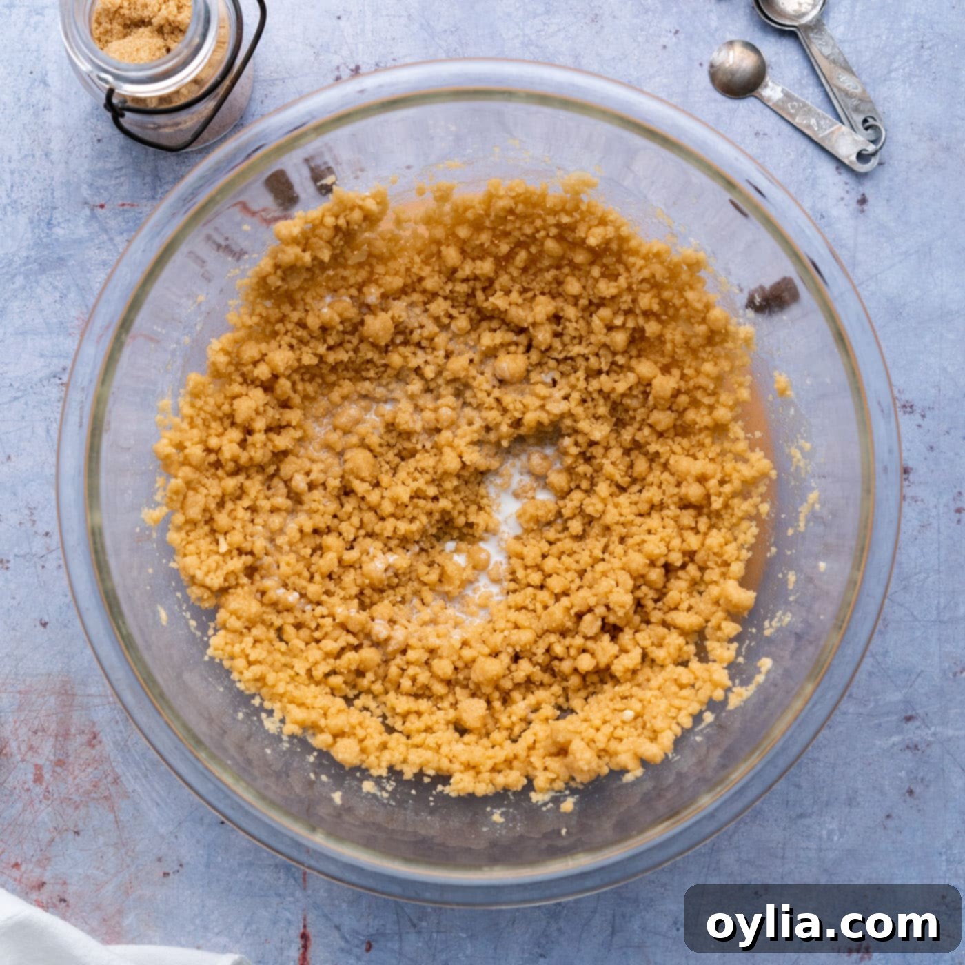 adding milk to cookie dough