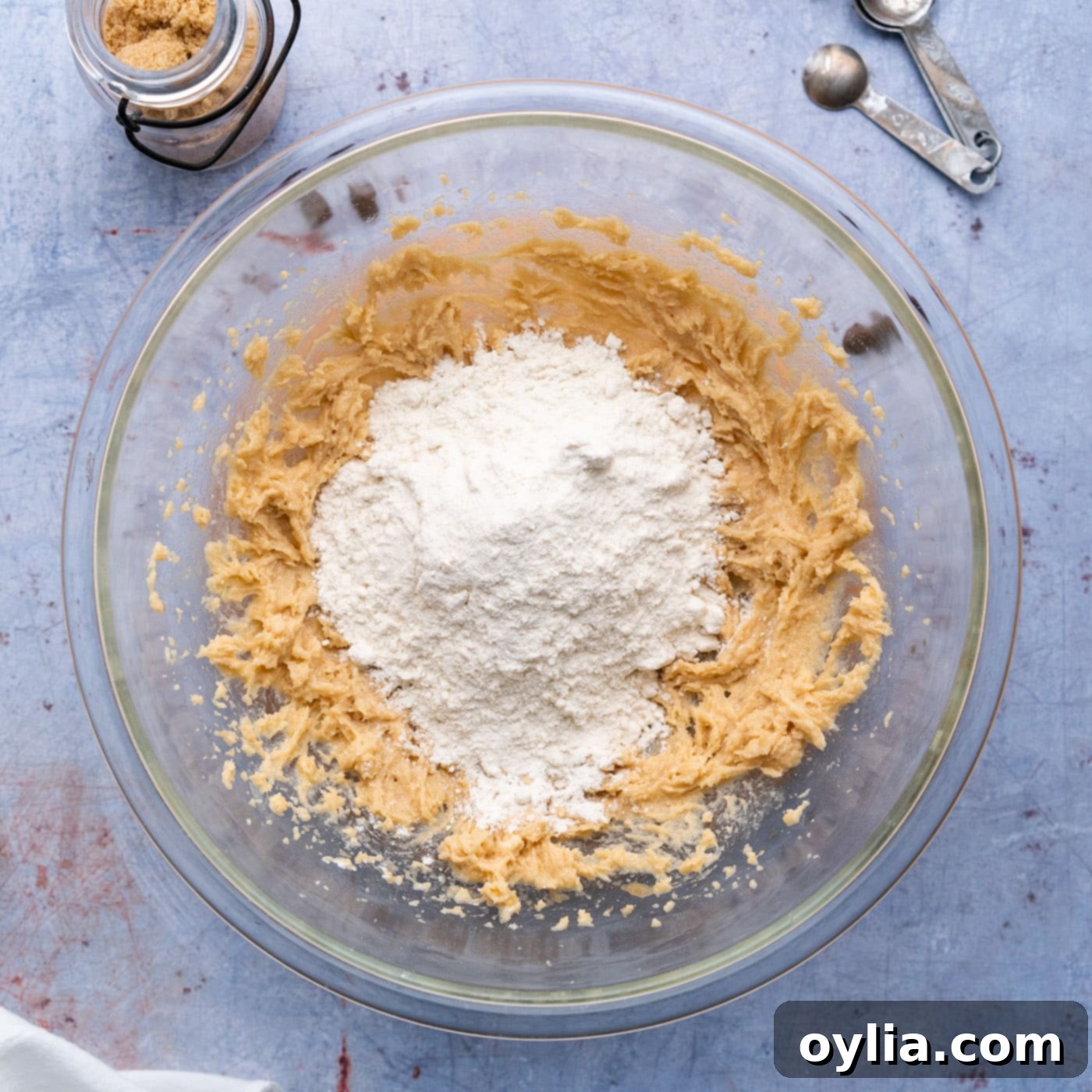 adding heat-treated flour to cookie dough mixture
