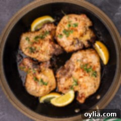 Garlic Butter Pork Chops in a skillet, ready to be served