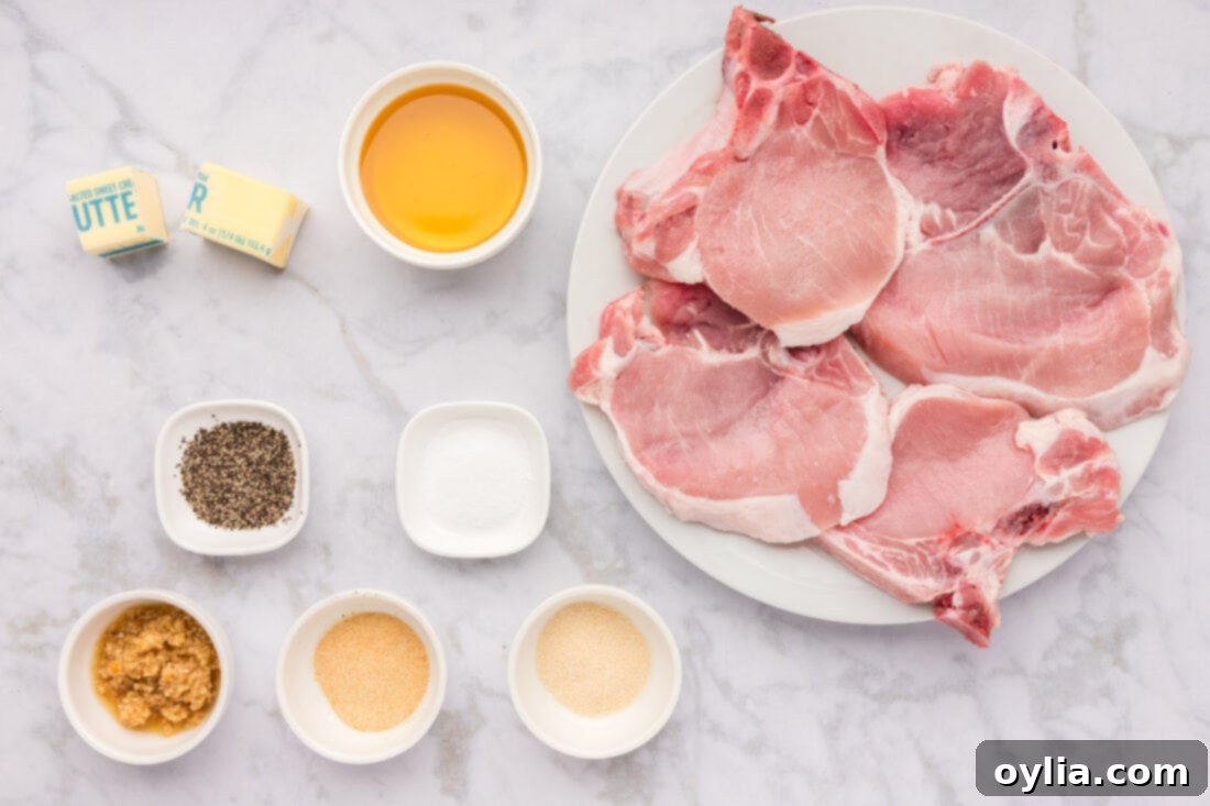 All the fresh and pantry ingredients laid out for making Skillet Garlic Butter Pork Chops