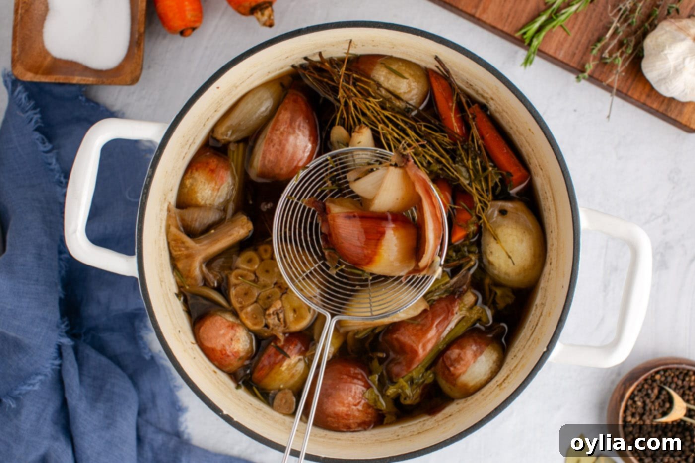 straining homemade vegetable broth