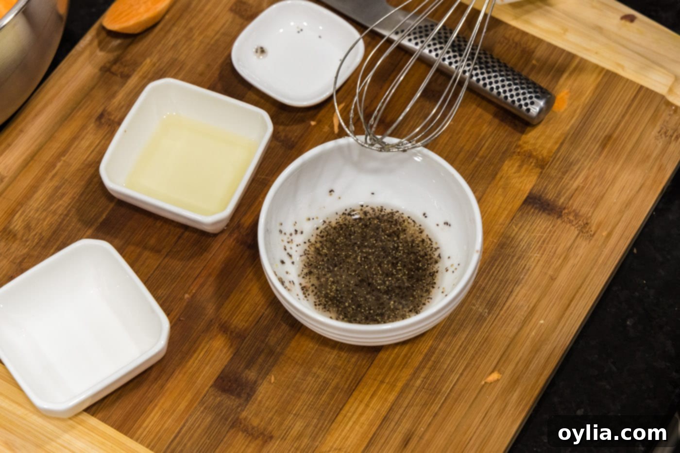 whisking oil, salt, and pepper mixture in a small bowl