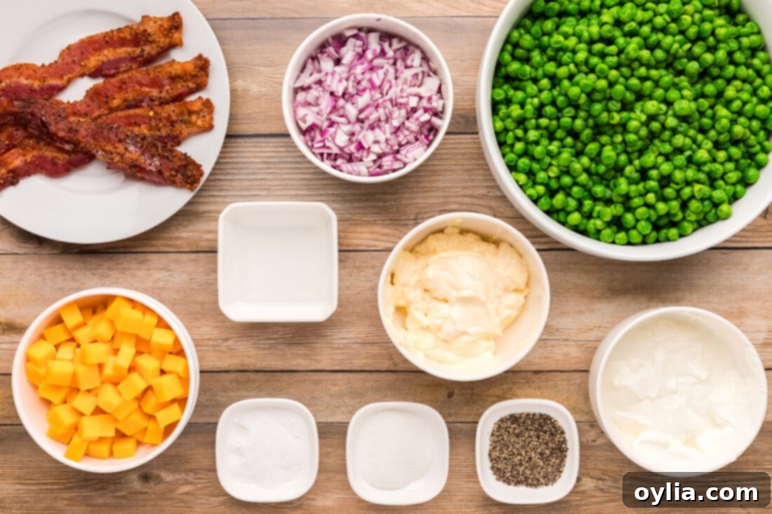 A selection of fresh ingredients for Pea Salad, including a bag of frozen peas, diced red onion, strips of cooked bacon, and a block of cheddar cheese