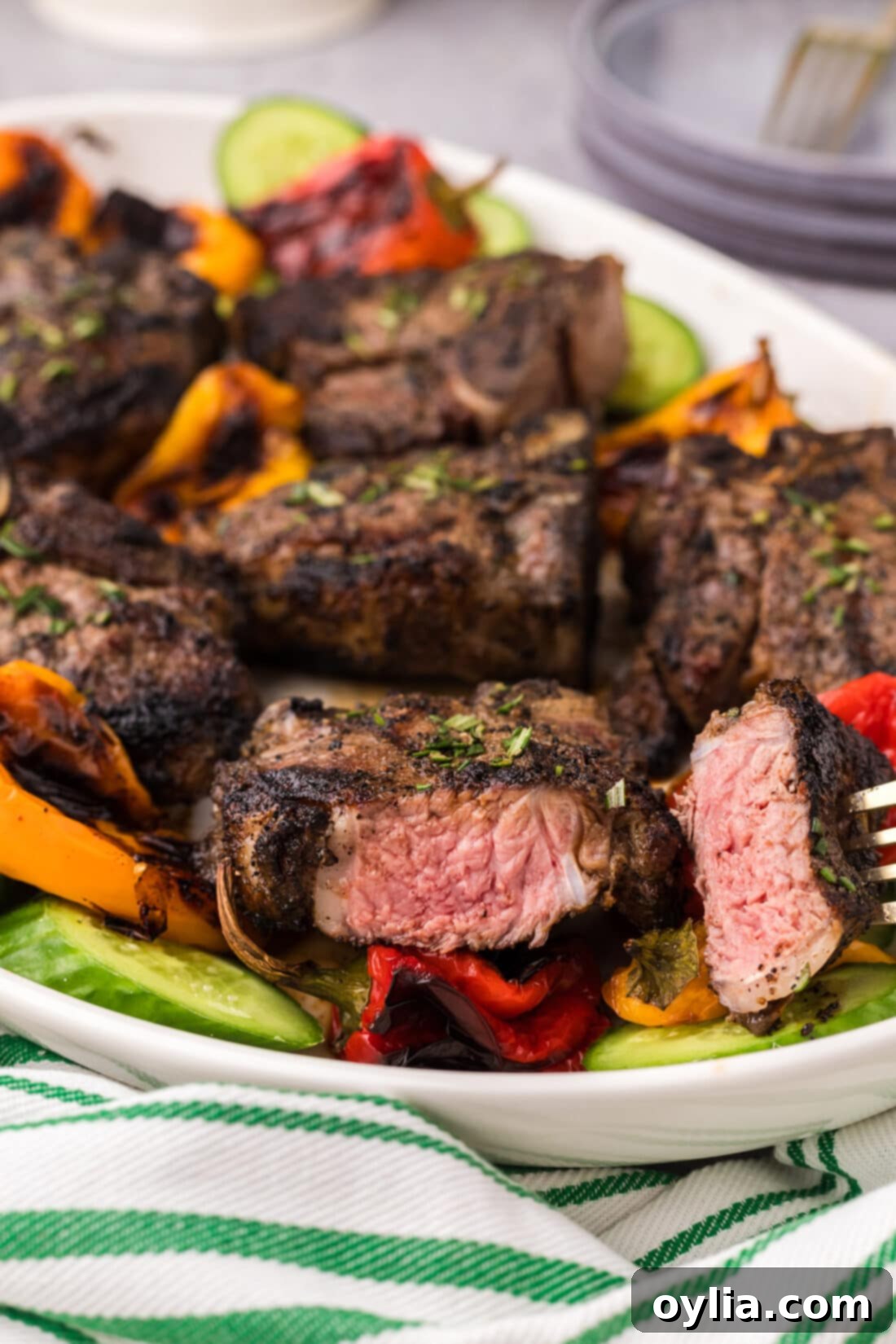 Succulent Grilled Lamb Loin Chops 13 Piece of Grilled Lamb Loin Chop on a fork
