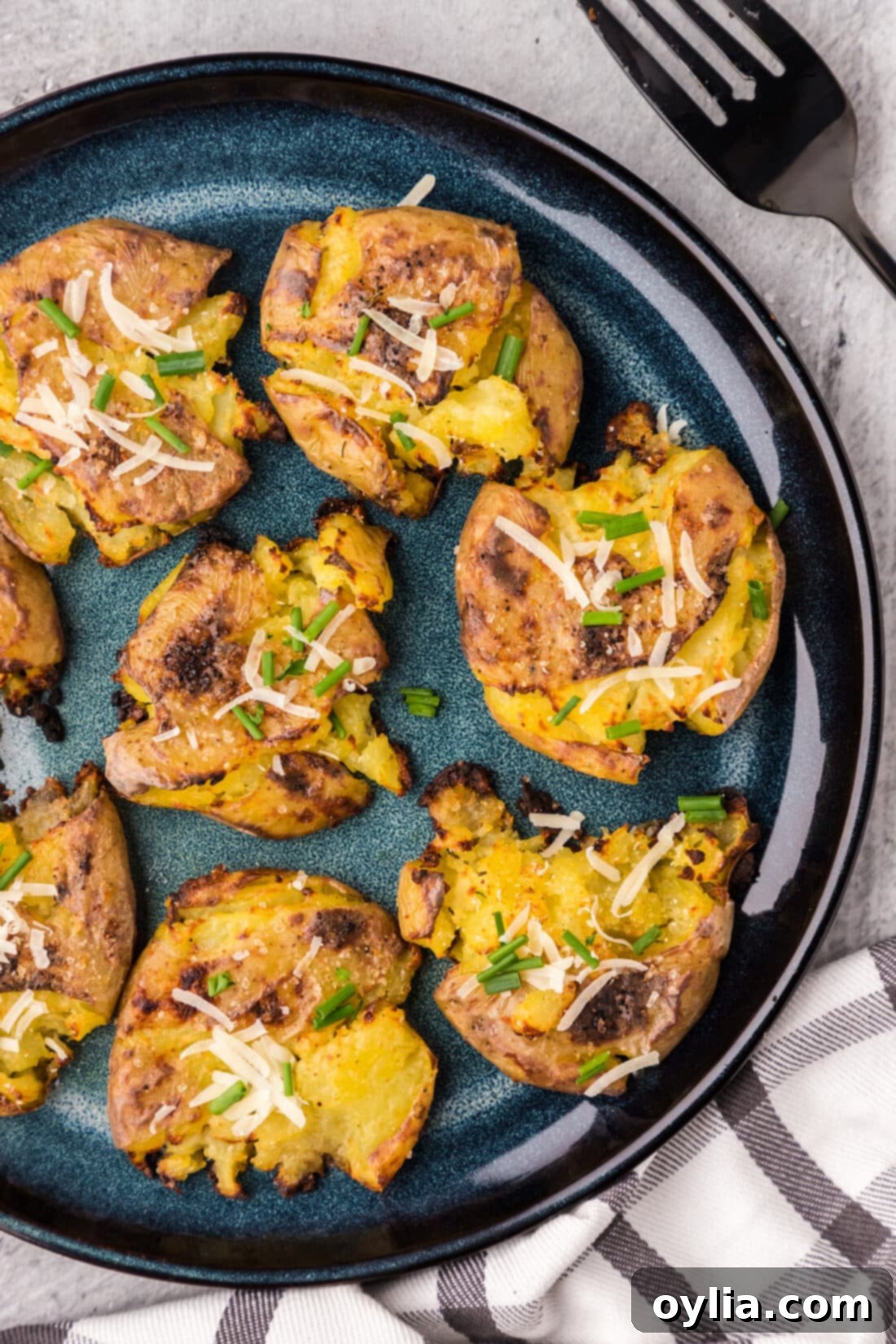 Close up photo of Smashed Potatoes on a blue plate
