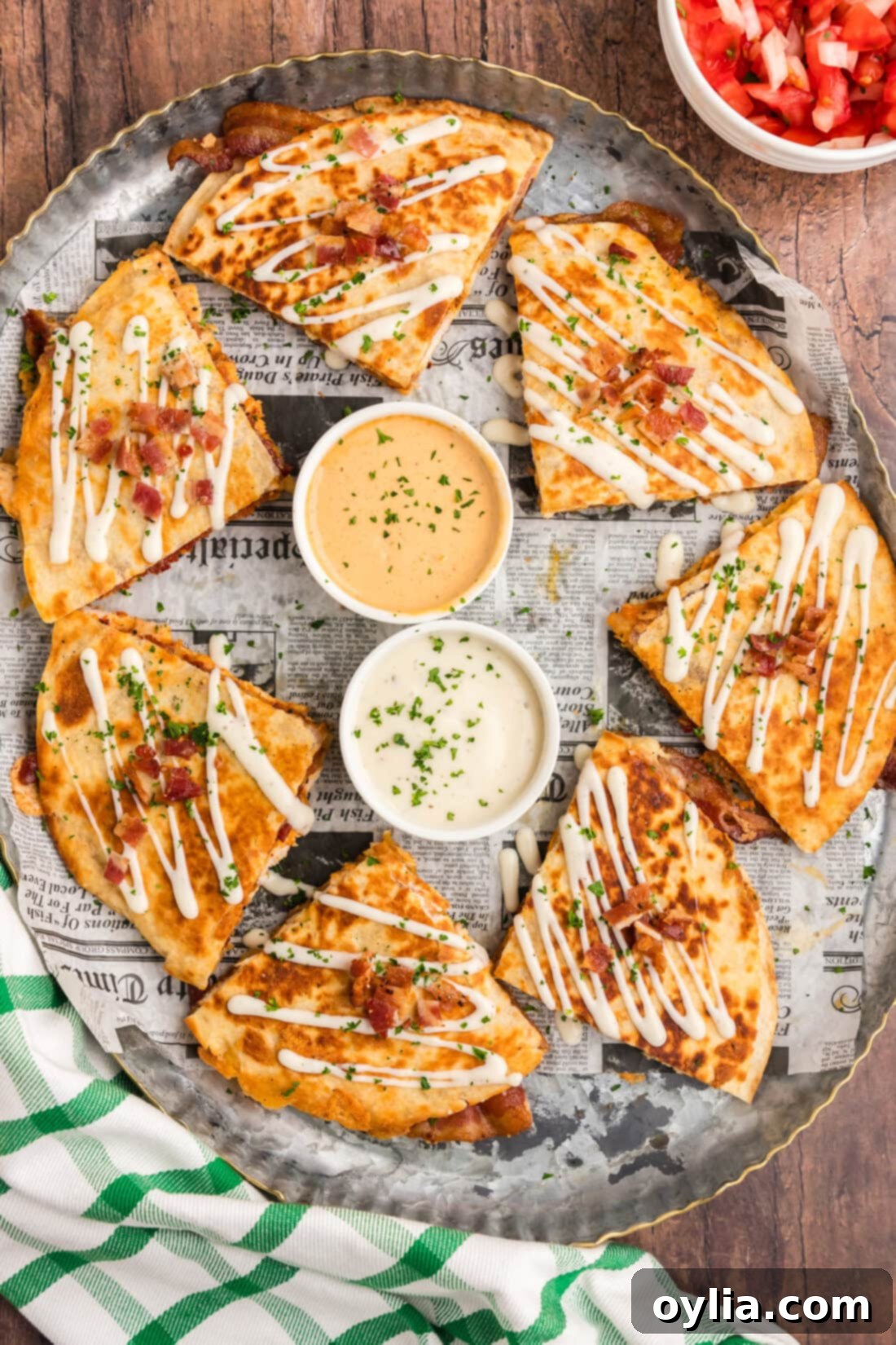 Platter of Chicken Bacon Ranch Quesadillas cut into triangles, perfectly golden brown and ready to eat.