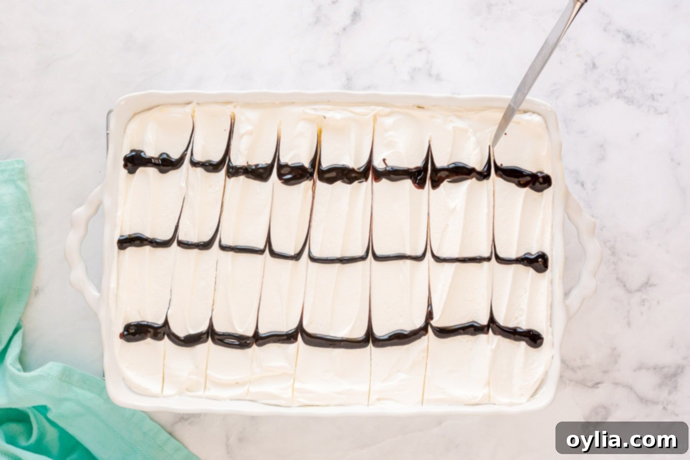 using a knife to drag chocolate lines