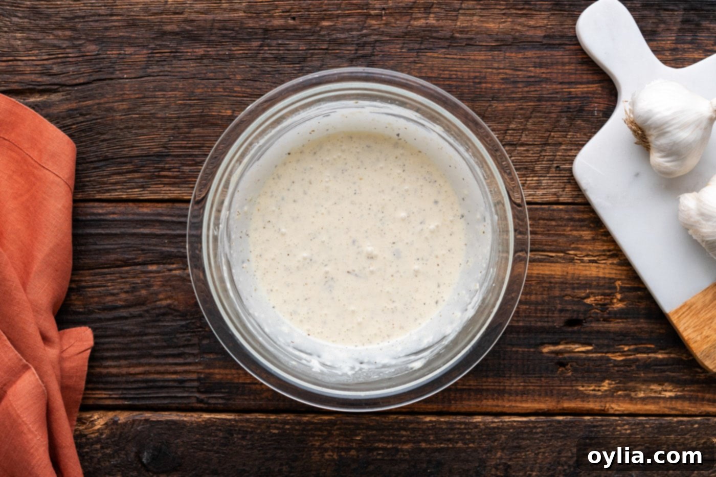 finished homemade garlic parmesan wing sauce in a bowl after mixing