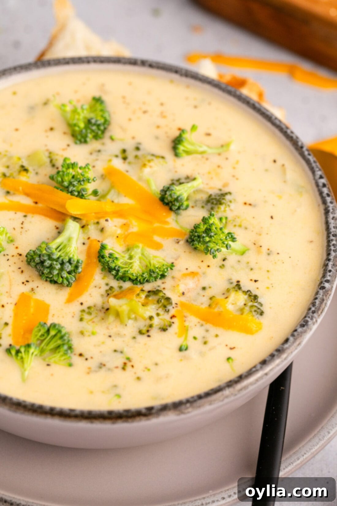 Close up photo of a bowl of Instant Pot Broccoli Cheddar Soup