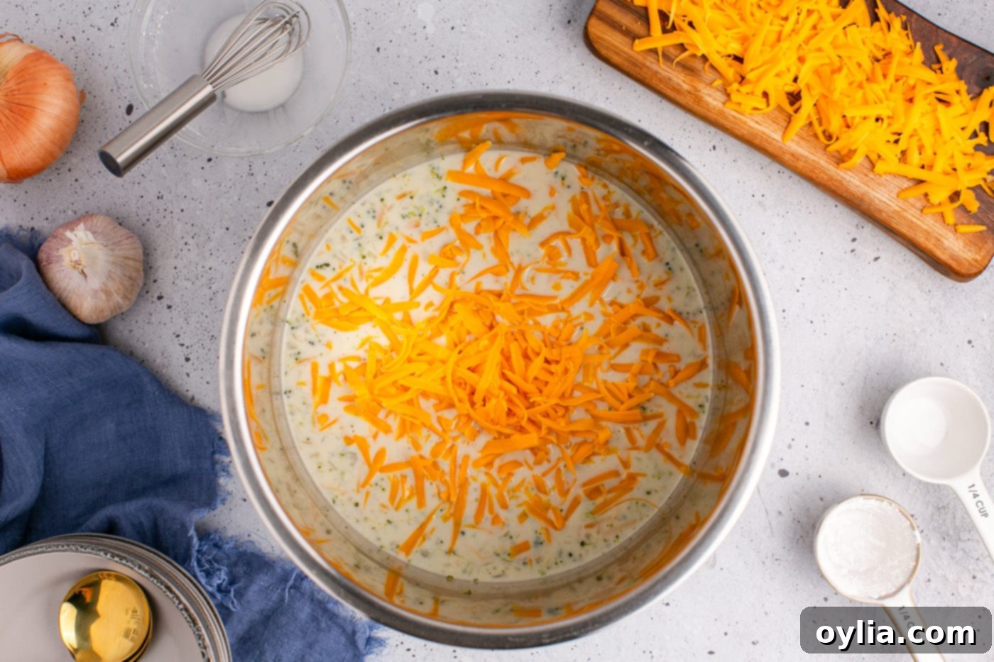 grated cheddar cheese added to broccoli cheddar soup with half and half