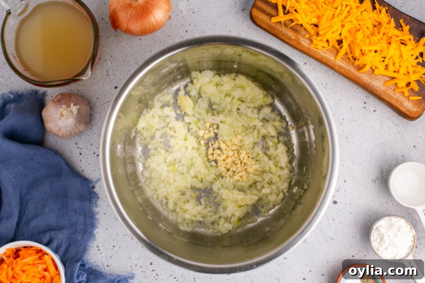 garlic added to melted butter and onion mixture in an instant pot