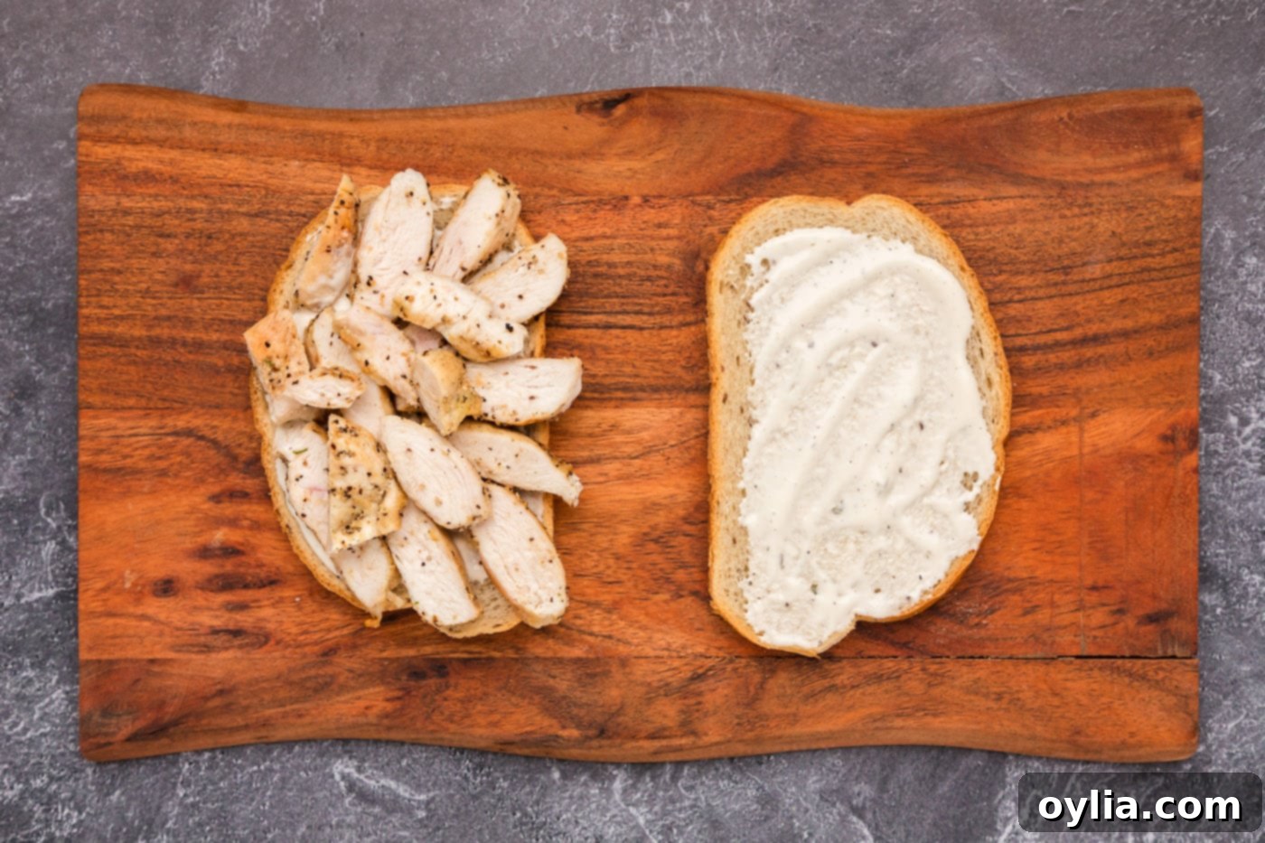 sliced chicken breast on top of ranch and rye bread