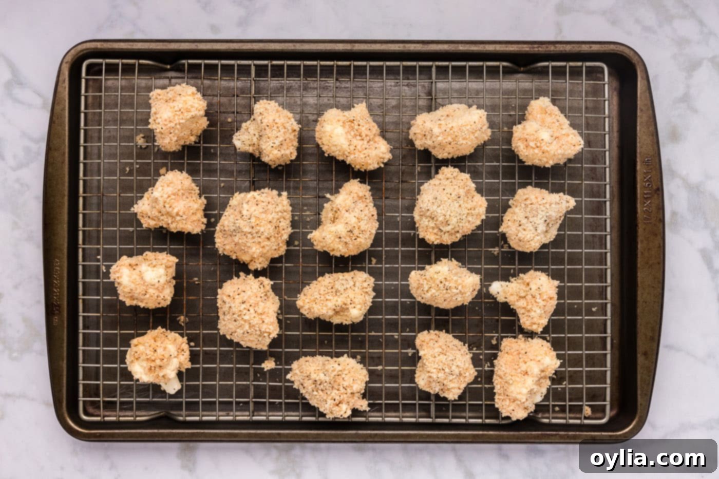 panko breadcrumb coated cauliflower florets on a wire rack