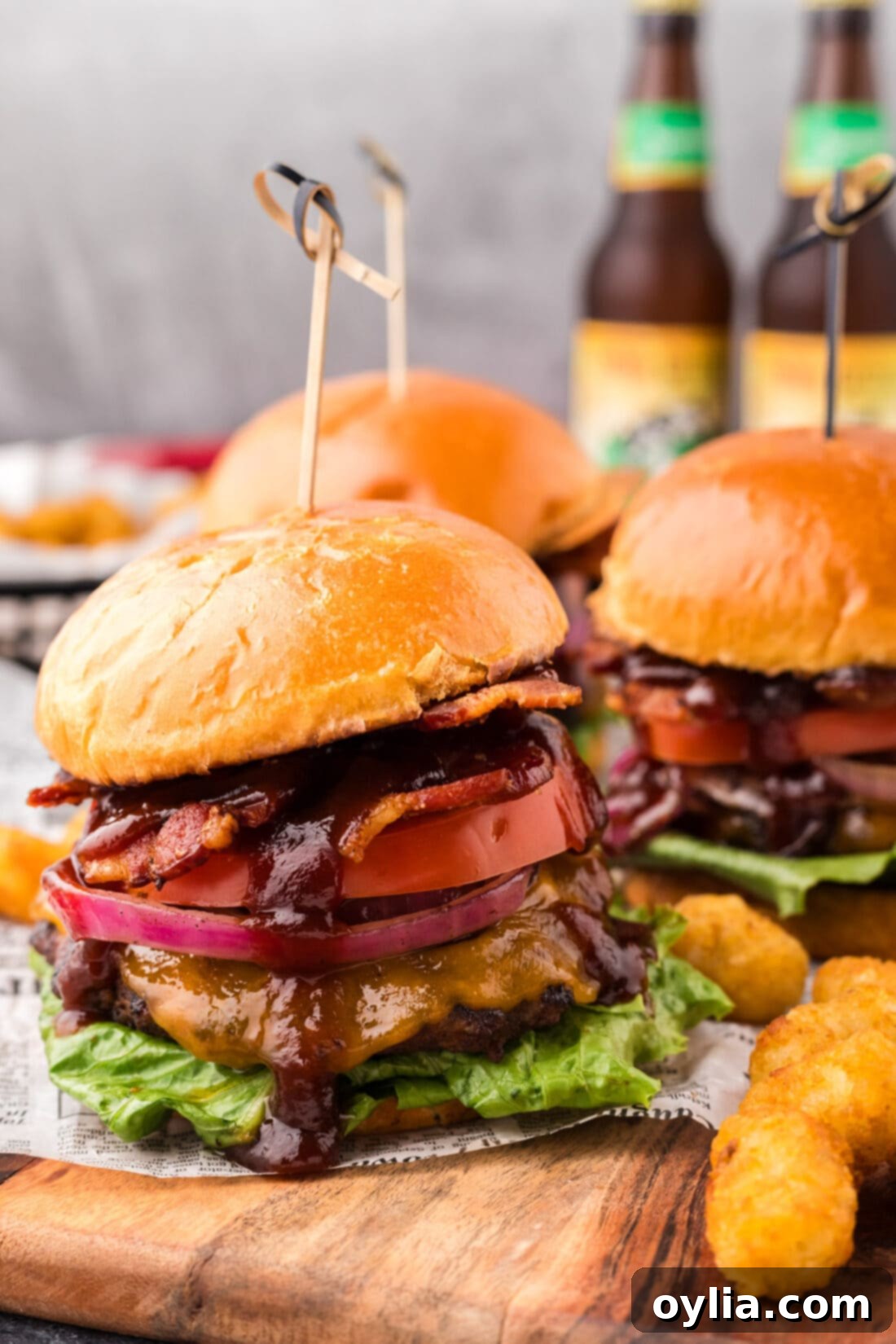 BBQ Bacon Burgers on a wooden board