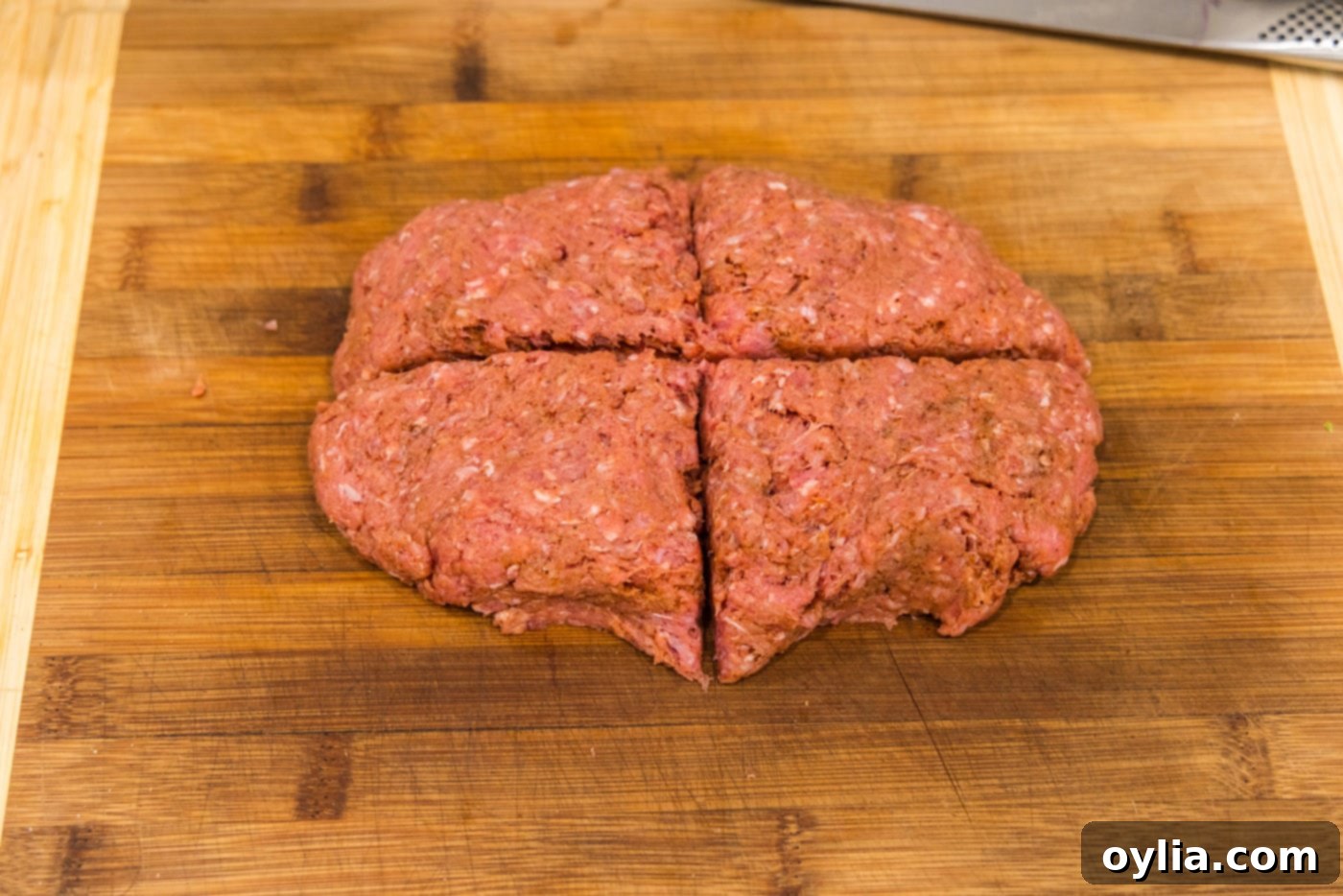 slicing burger patty into 4 triangles