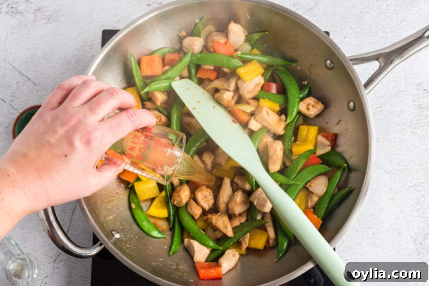 kung pao chicken stir fry in a wok