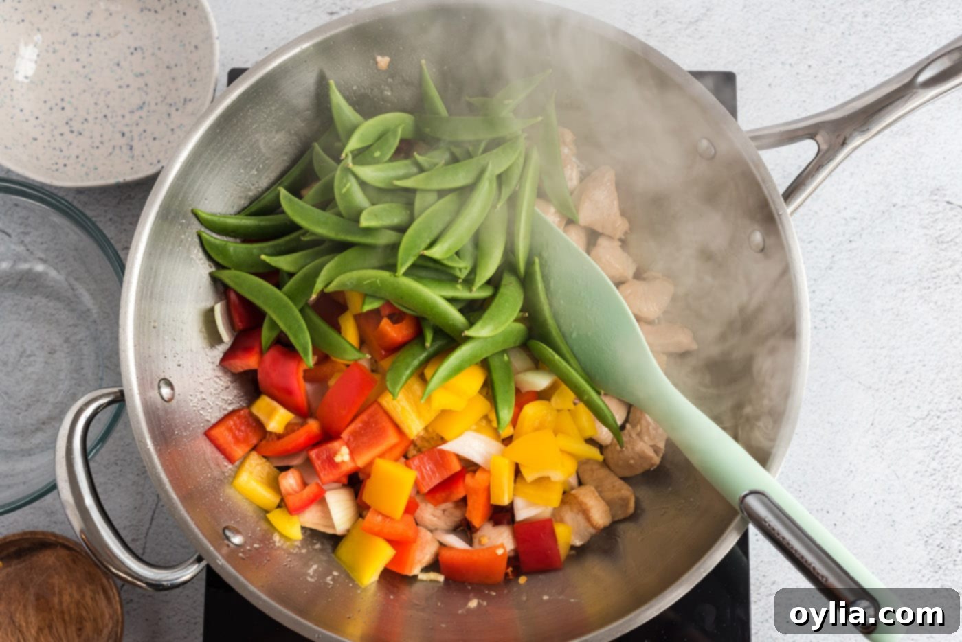 veggies with chicken in a wok