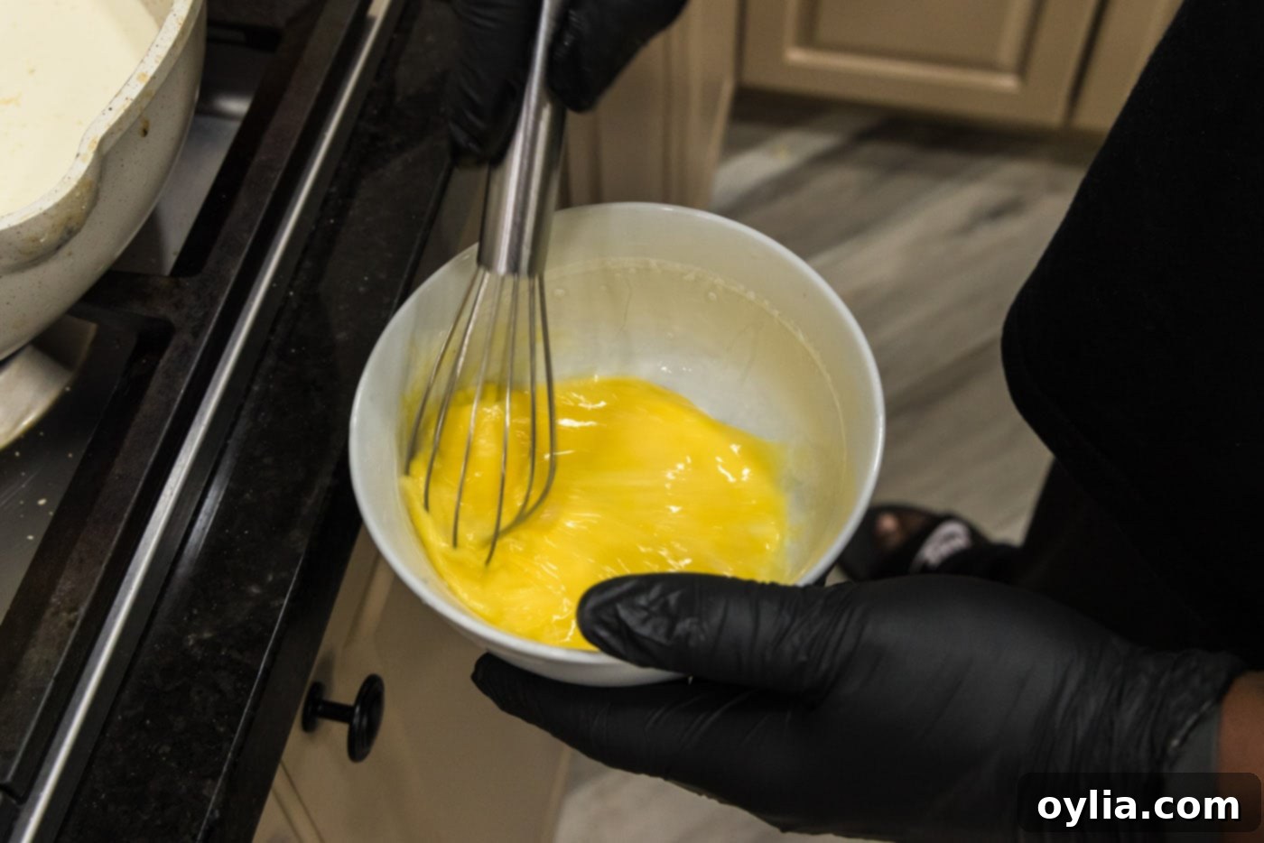 whisking eggs in a bowl