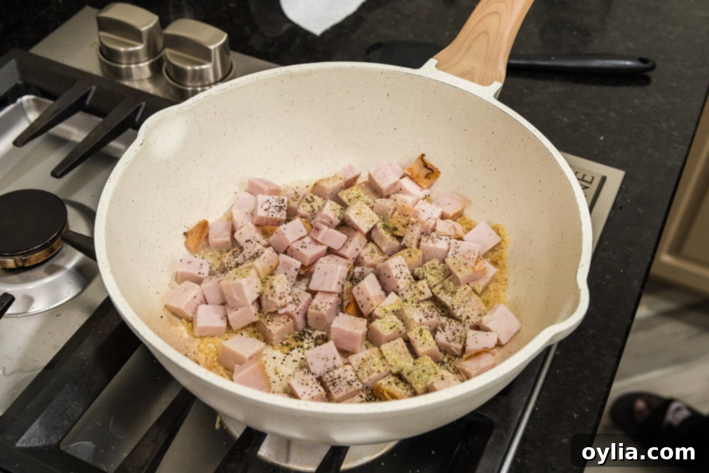 cubed turkey and seasonings added to oil mixture in skillet