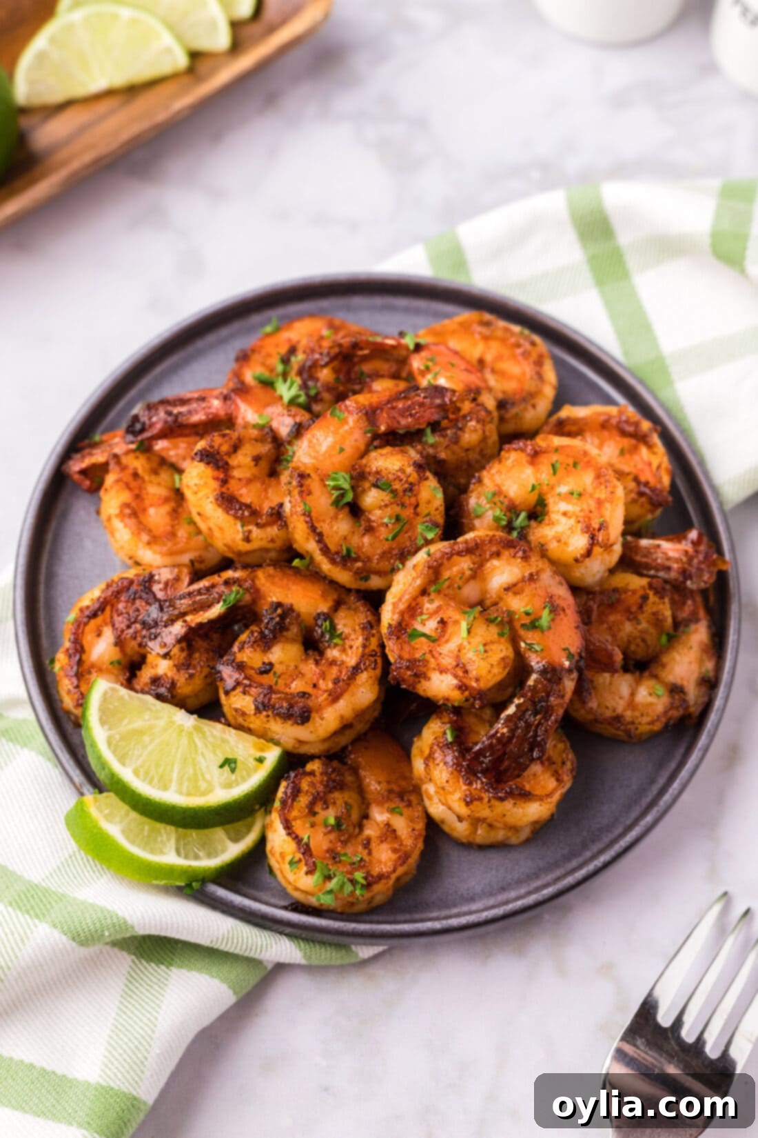 Plate of perfectly cooked Spicy Shrimp, garnished and ready to serve