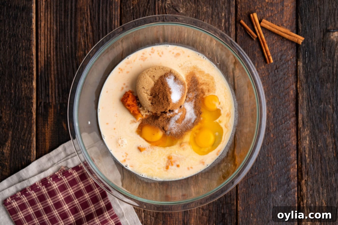 eggs, sugar, and pumpkin puree in a bowl